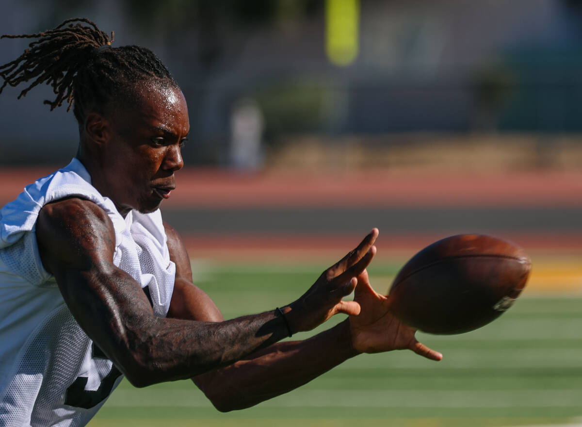 Clark High School wide receiver Dre Pollard makes a catch during a drill at practice on Tuesday ...