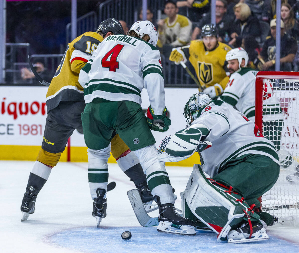 Minnesota Wild goaltender Marc-Andre Fleury (29) has the puck slide by but Golden Knights right ...
