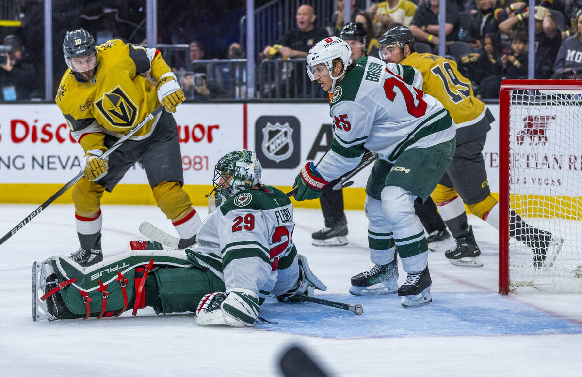 Minnesota Wild goaltender Marc-Andre Fleury (29) goes down as Golden Knights center Nicolas Roy ...