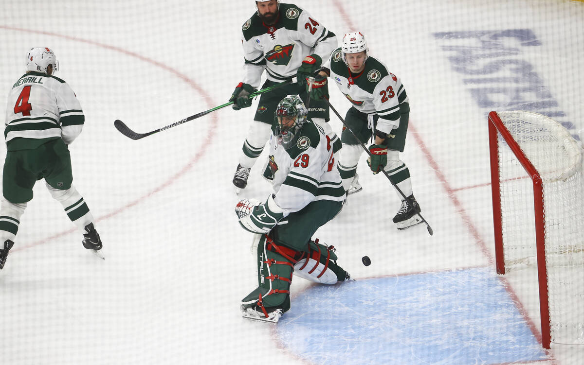 Golden Knights center Brett Howden, out of frame, scores a goal past Minnesota Wild goaltender ...
