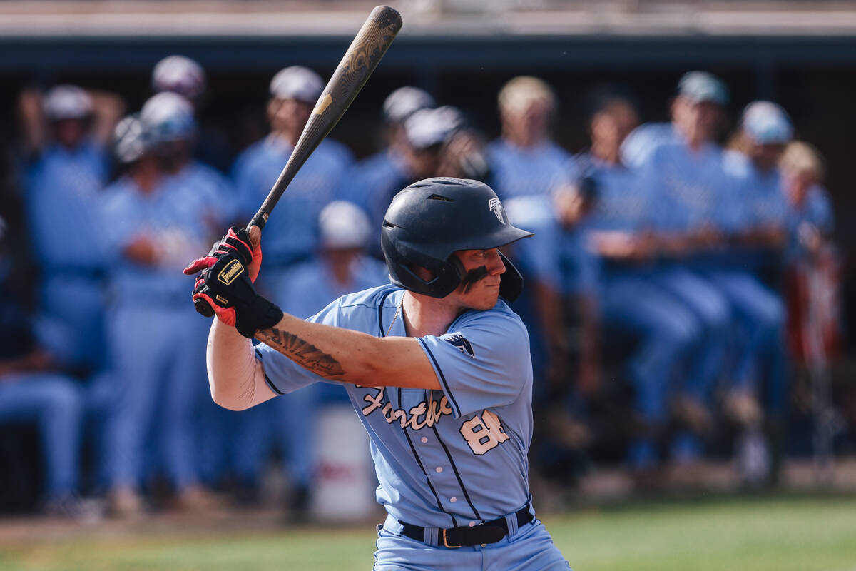 Foothill utility player Landon Angelo eyes the ball during a high school baseball game between ...