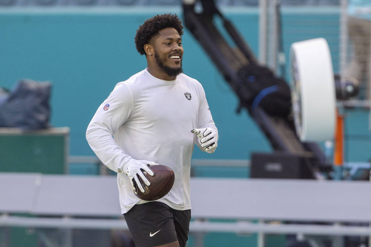 Raiders running back Josh Jacobs warms up before an NFL game against the Miami Dolphins on Sund ...