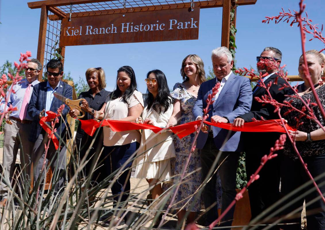 Invitees, including North Las Vegas Mayor Pamela Goynes-Brown, third left, and Councilwoman Rut ...