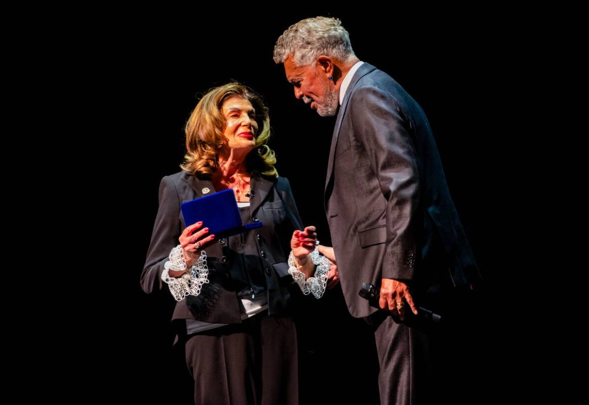 Las Vegas Mayor Shelley Berkley stands onstage with singer Clint Holmes during the State of the ...