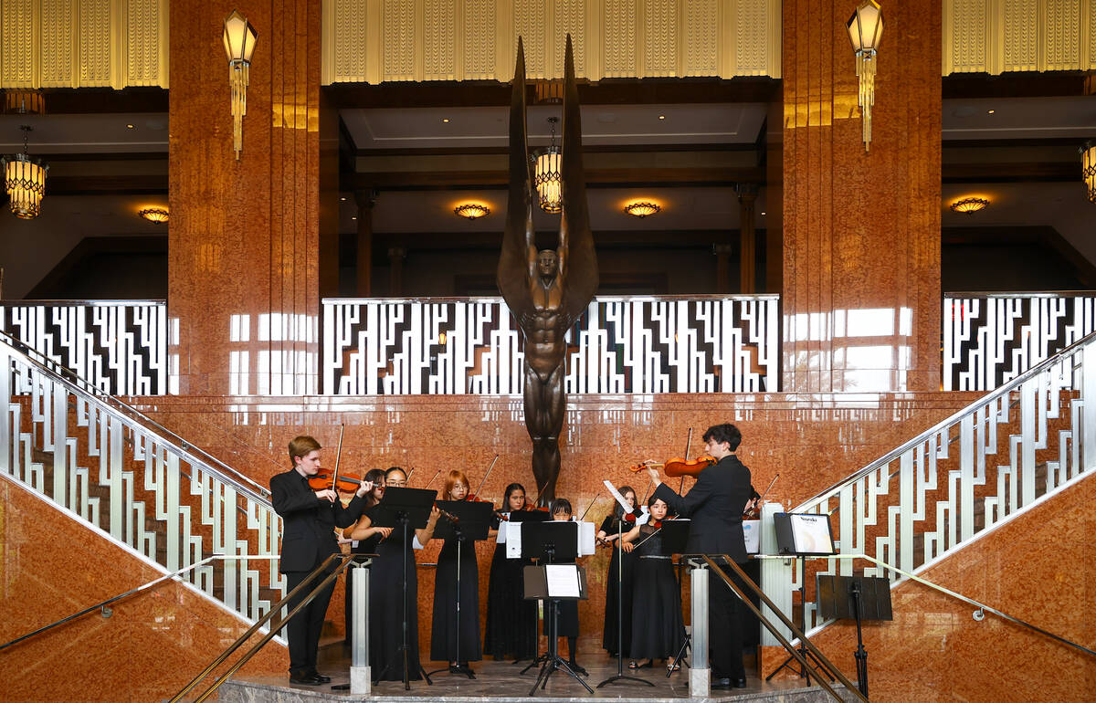 Music students with the String Connection perform before Las Vegas Mayor Shelley Berkley, not p ...