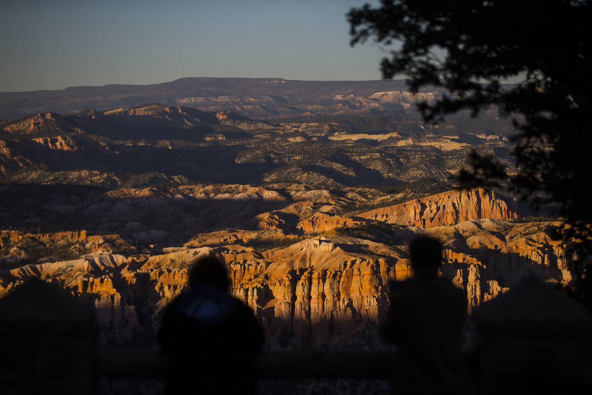 People take in the view from Bryce Point at Bryce Canyon National Park, Utah on Saturday, Oct. ...