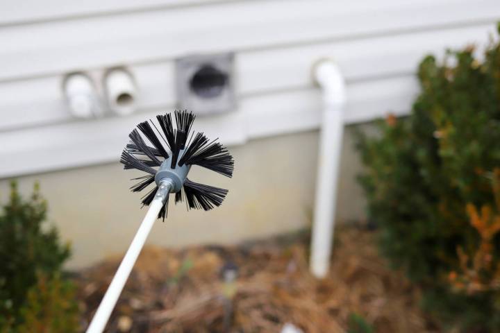 Cleaning the dryer vent requires a round brush on a long flexible snake. (Getty Images)