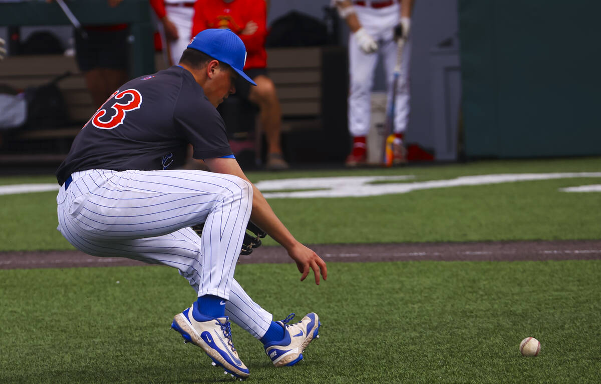 Bishop Gorman's James Whitaker fields a bunt during a baseball game against Archbishop Moeller, ...