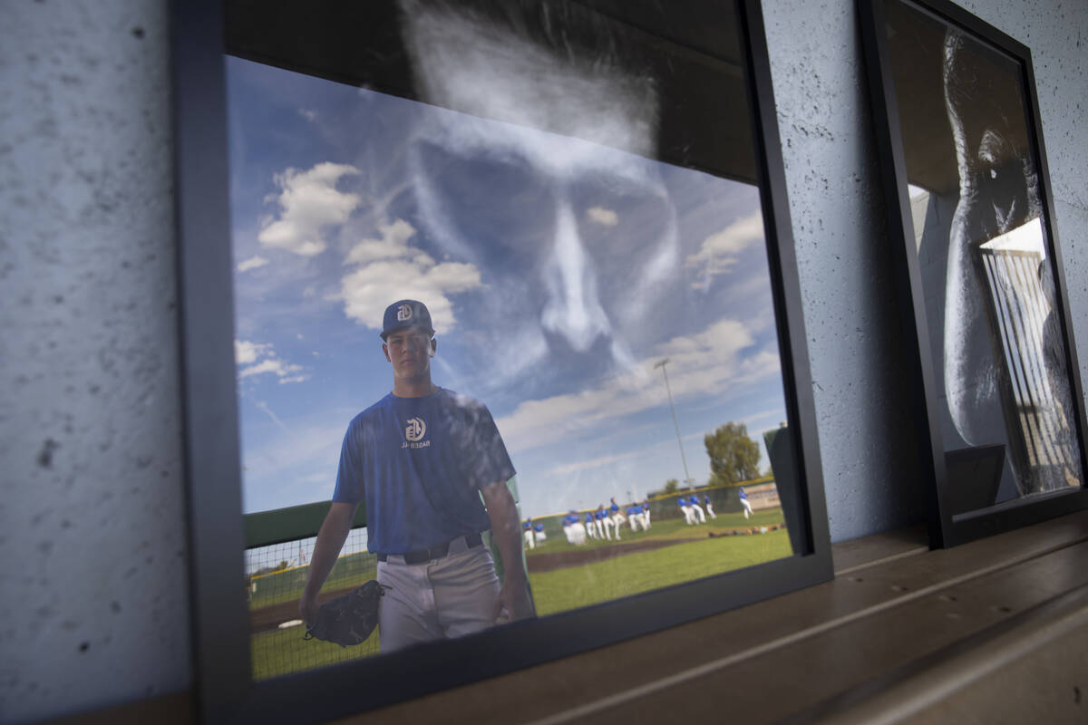 Bishop Gorman pitcher James Whitaker poses with some of his artwork in the dugout at Bishop Gor ...