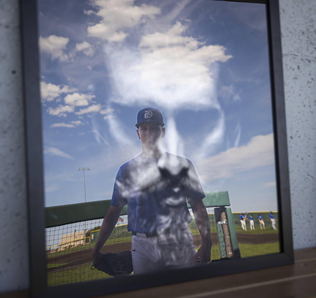Bishop Gorman pitcher James Whitaker poses with some of his artwork in the dugout at Bishop Gor ...