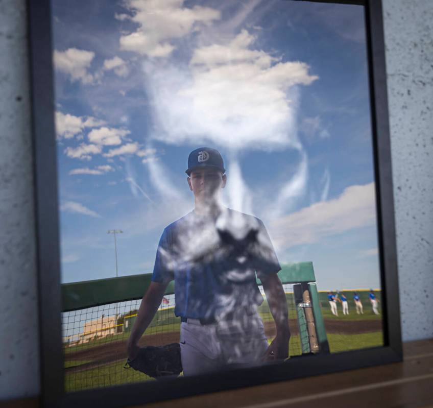 Bishop Gorman pitcher James Whitaker poses with some of his artwork in the dugout at Bishop Gor ...