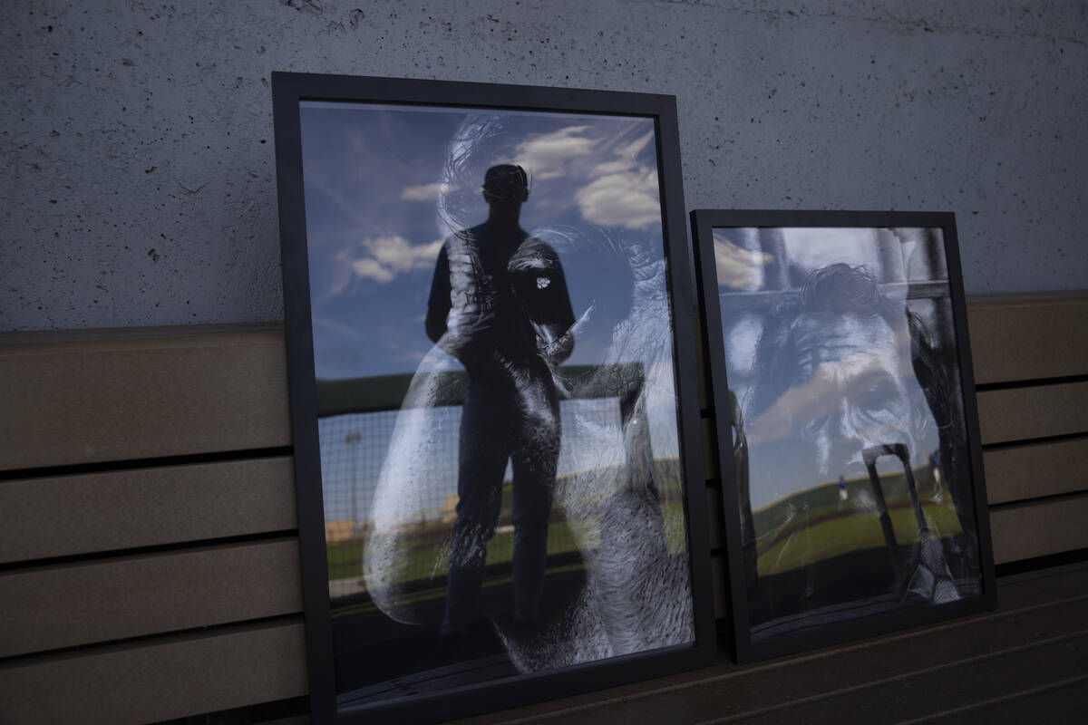 Bishop Gorman pitcher James Whitaker poses with some of his artwork in the dugout at Bishop Gor ...