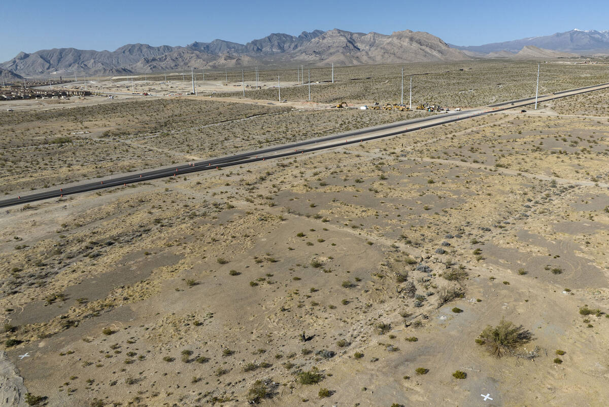An aerial view of a vacant land that recently sold, front right, located on the north side of K ...