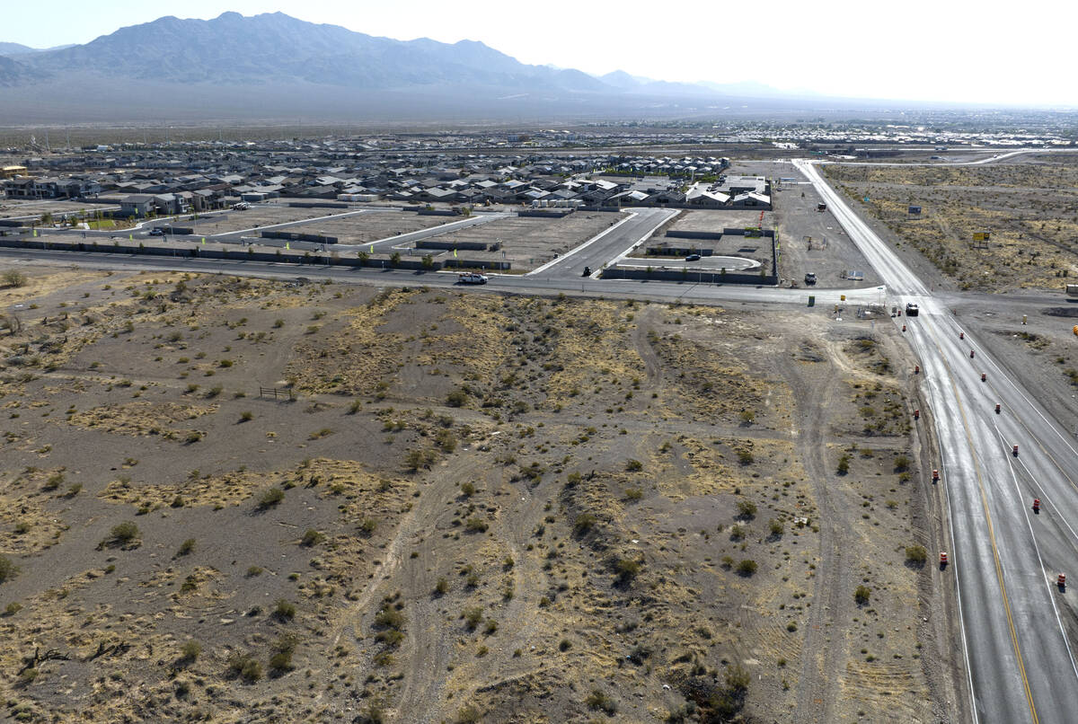 An aerial view of a vacant land that recently sold, front left, located on the north side of Ky ...