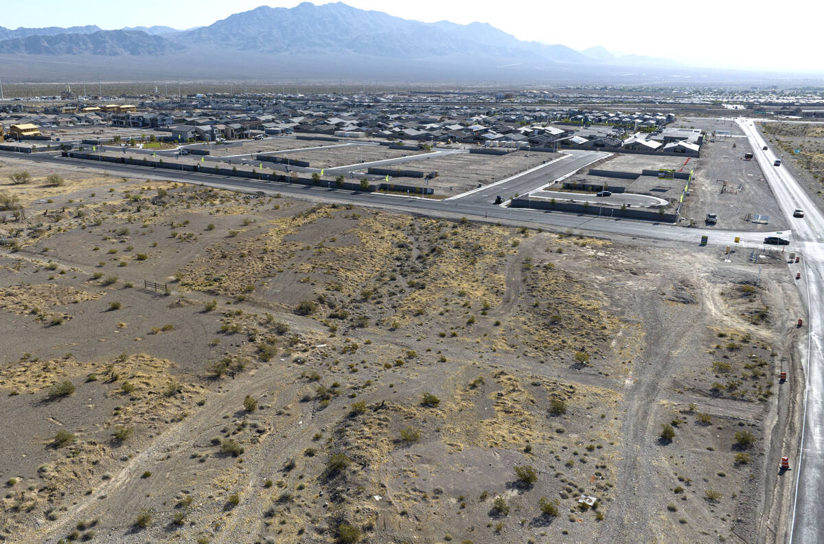 An aerial view of a vacant land that recently sold, front left, located on the north side of Ky ...