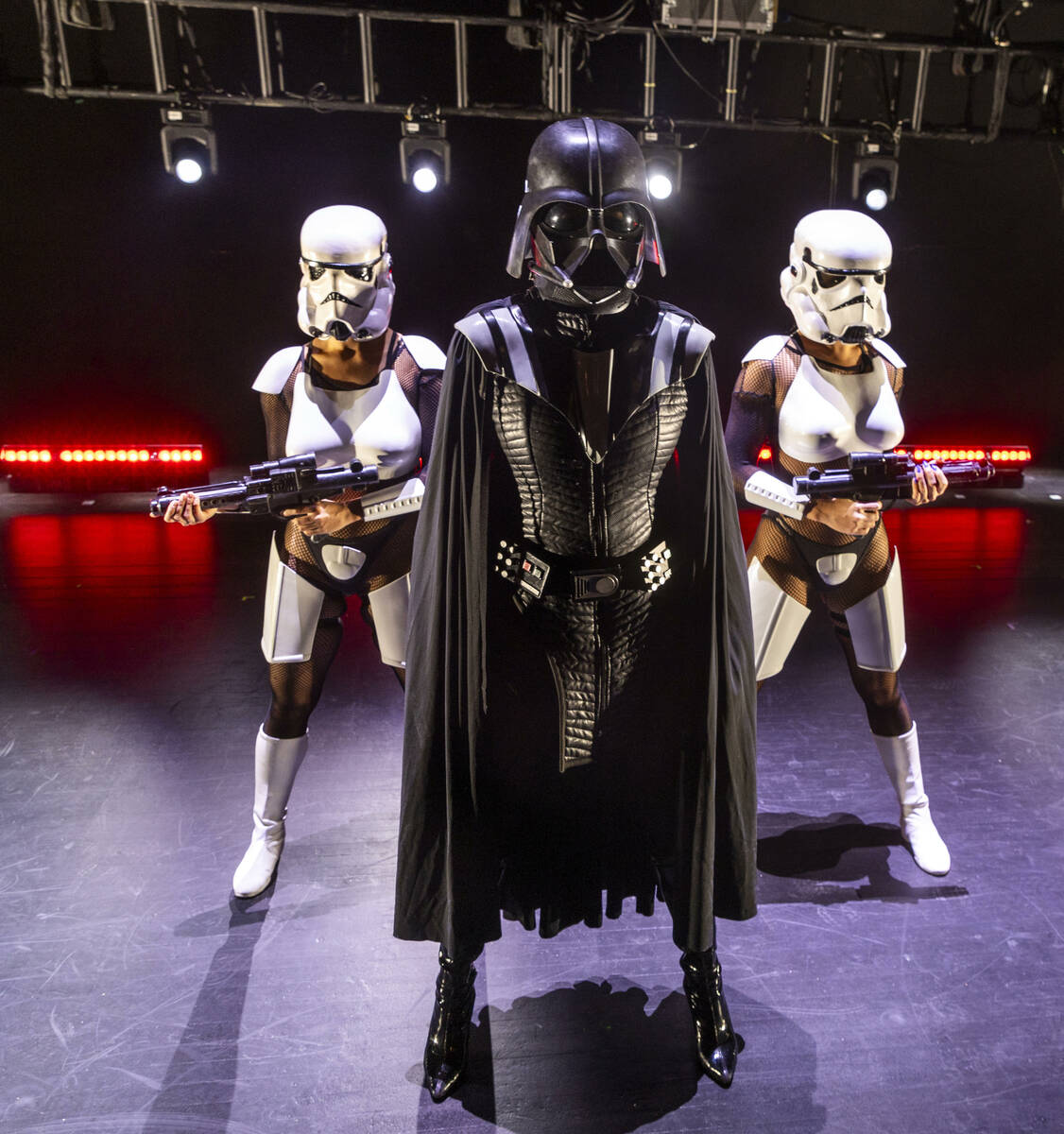 Vader and Stormtroopers from the burlesque Star Wars spoof "The Empire Strips Back" pose at the ...