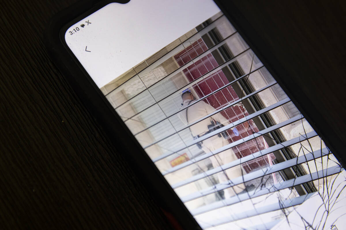 Mark Parmenter, not pictured, shows a video taken from his phone of police responding to a call ...