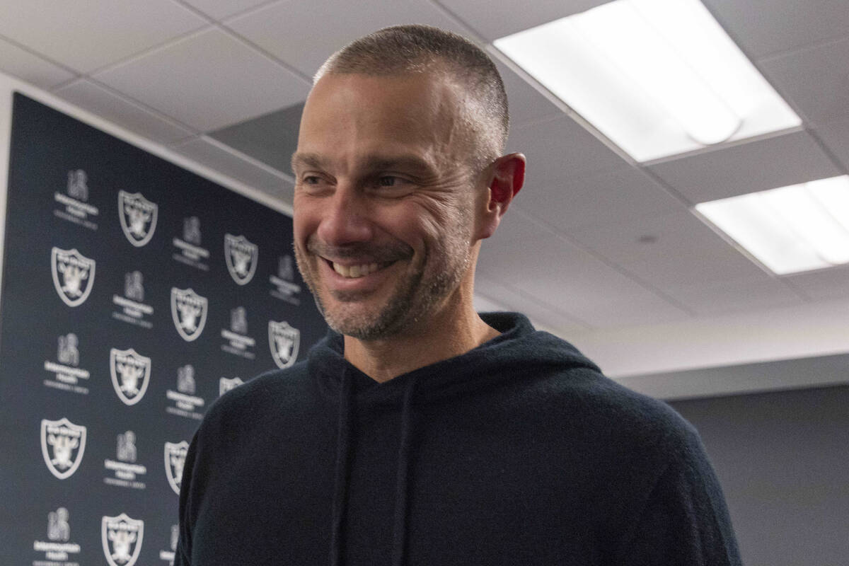 Raiders general manager John Spytek smiles as he leaves the media room following a news confere ...