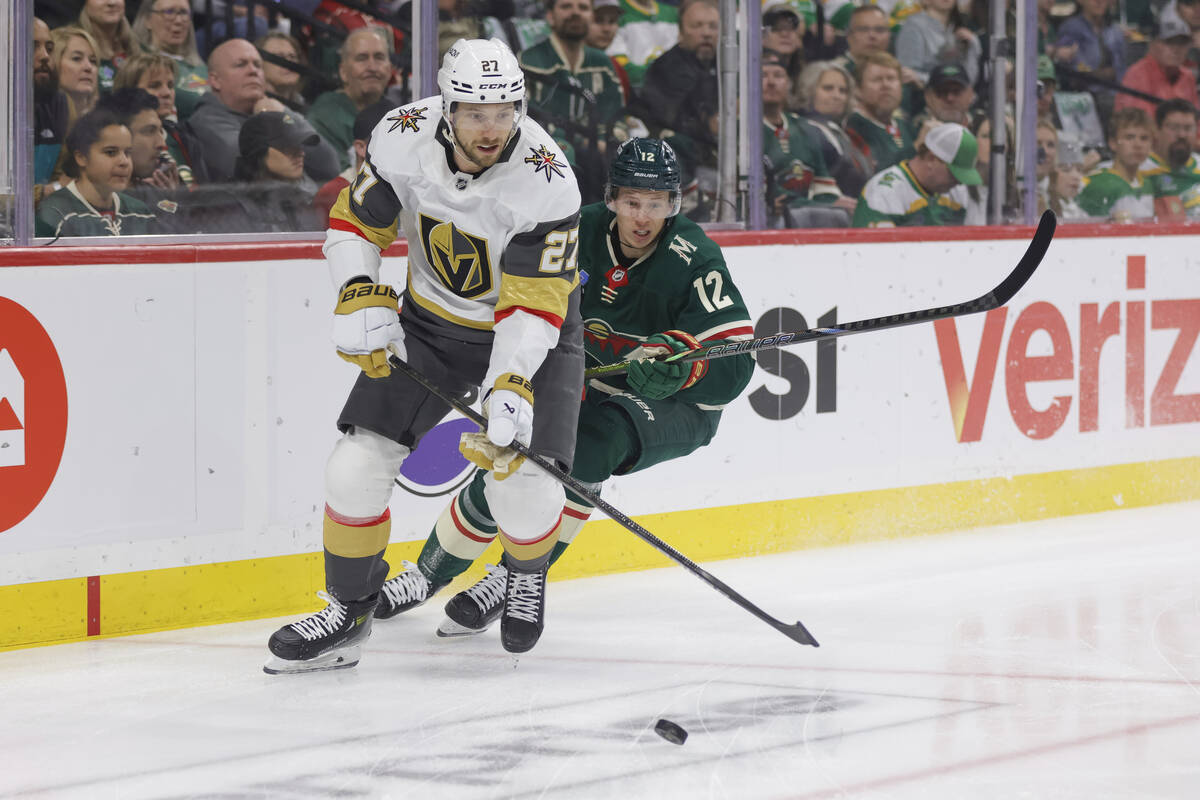 Minnesota Wild left wing Matt Boldy (12) and Vegas Golden Knights defenseman Shea Theodore (27) ...
