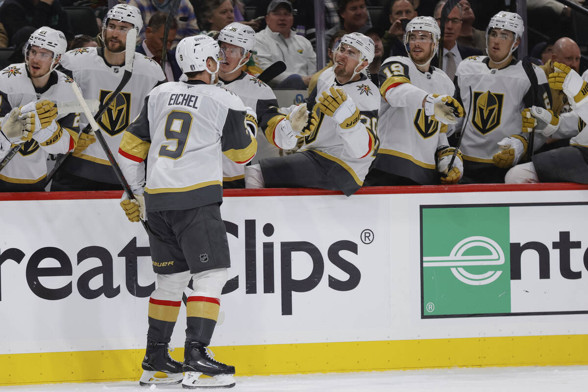Vegas Golden Knights center Jack Eichel (9) is congratulated by teammates after scoring during ...