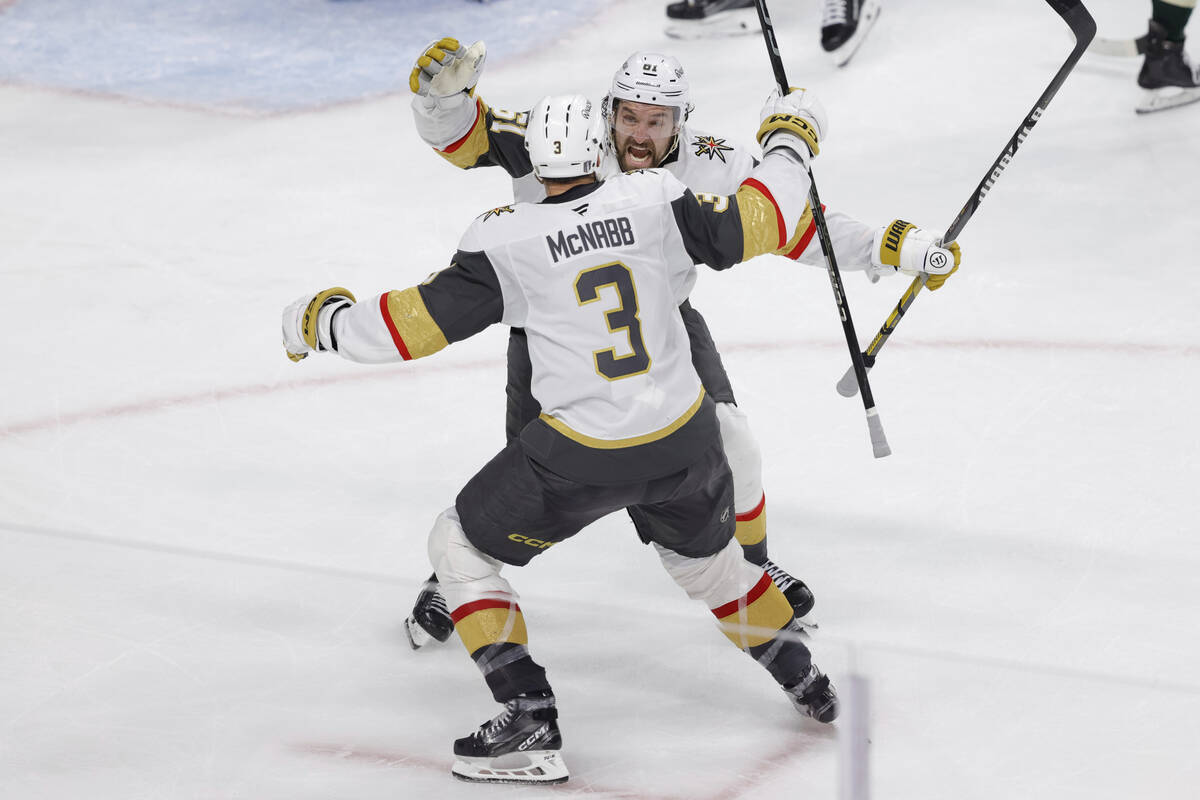 Vegas Golden Knights right wing Mark Stone (61) celebrates with defenseman Brayden McNabb (3) a ...
