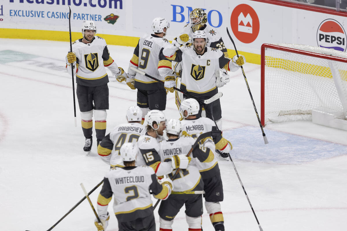 Vegas Golden Knights celebrate after winning Game 6 of a first-round NHL hockey playoff series ...