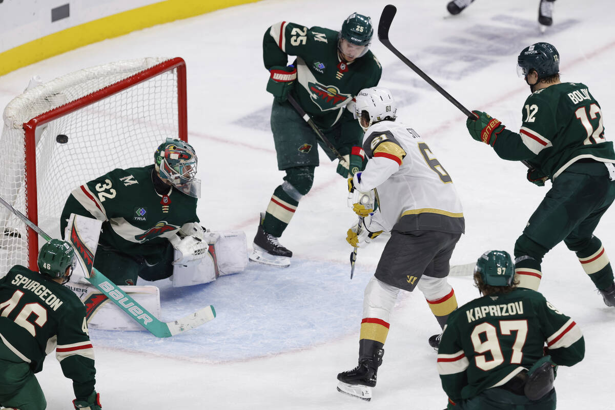 Vegas Golden Knights right wing Mark Stone (61) scores against Minnesota Wild goaltender Filip ...
