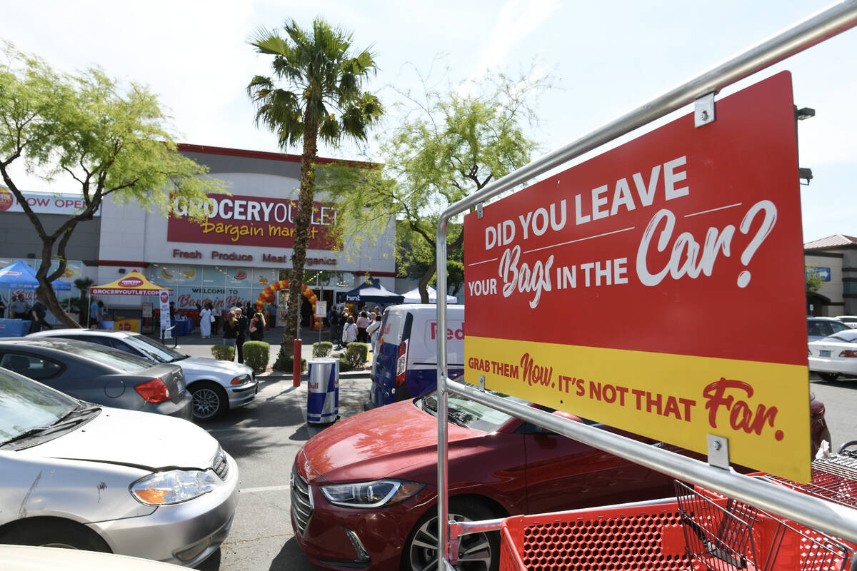 A sign reminds shoppers to bring their own shopping bags during the grand opening of a new Groc ...
