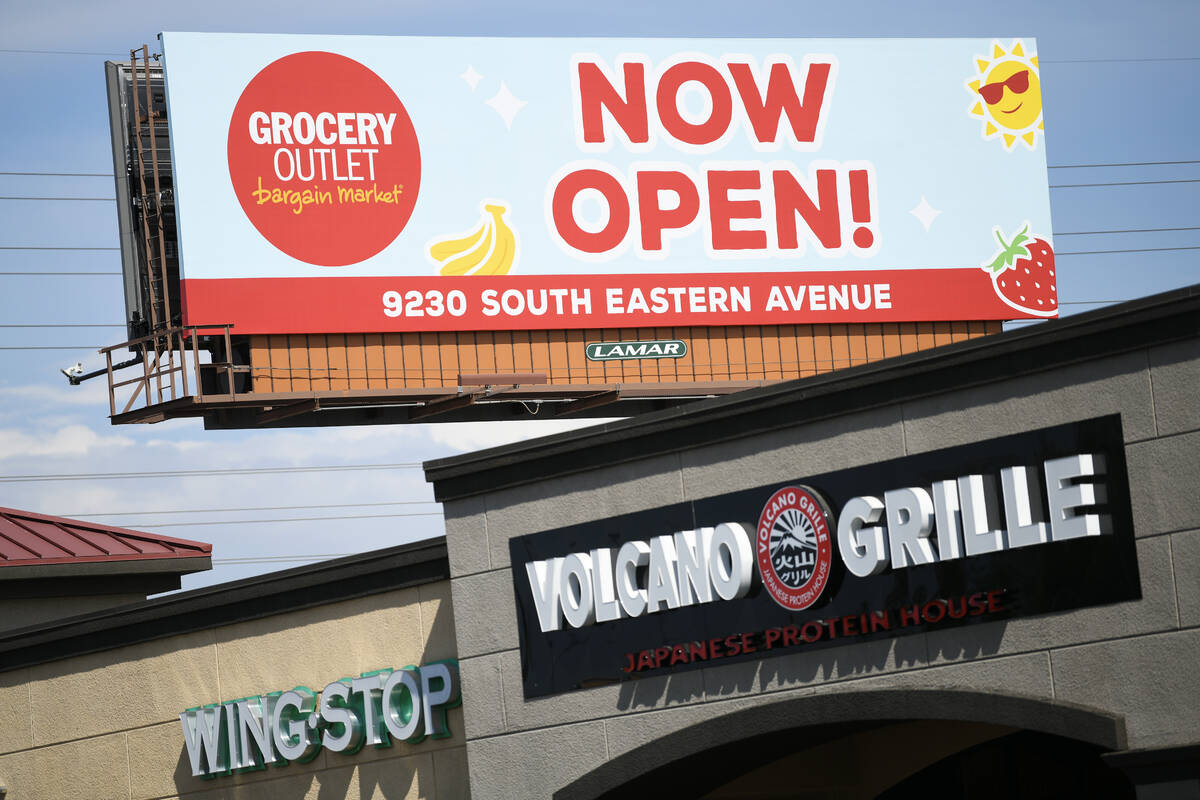 A billboard advertises the opening of a new Grocery Outlet at 9320 S. Eastern Avenue Thursday, ...