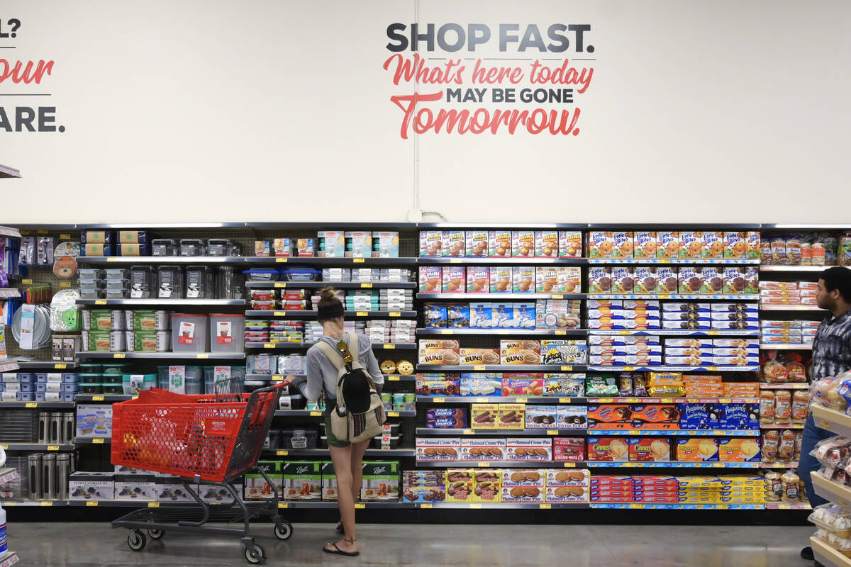 A shopper browses an aisle during the grand opening of a new Grocery Outlet at 9320 S. Eastern ...