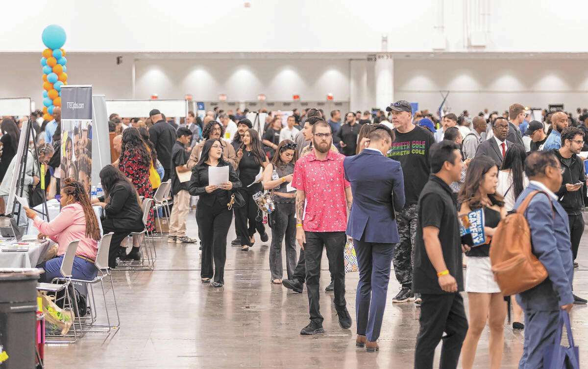 Attendees explore the spring job fair at the Las Vegas Convention Center on Thursday, May 1, 20 ...