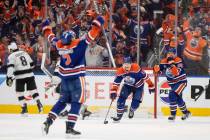 Edmonton Oilers' Evan Bouchard (2), Zach Hyman (18) and Corey Perry (90) celebrate a goal again ...