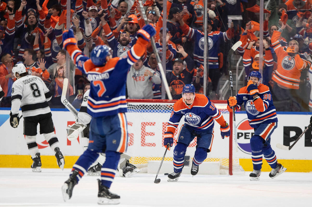 Edmonton Oilers' Evan Bouchard (2), Zach Hyman (18) and Corey Perry (90) celebrate a goal again ...