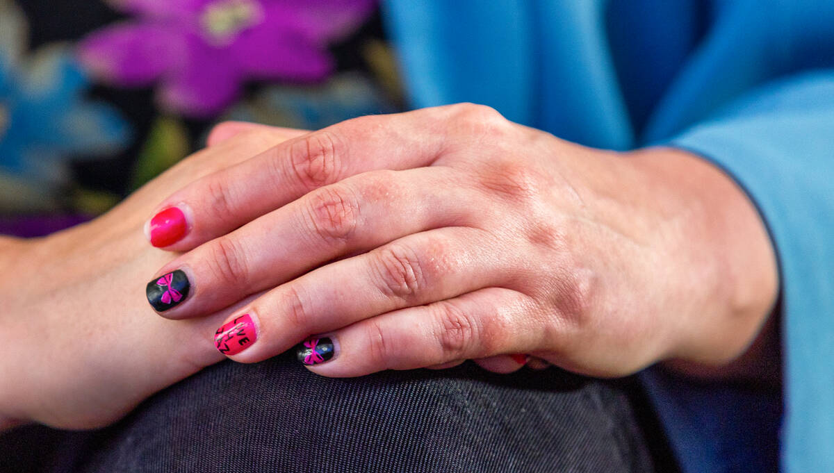 Susan Johnson wears the favorite colors of daughter Jazlynn on her nails. (L.E. Baskow/Las Vega ...