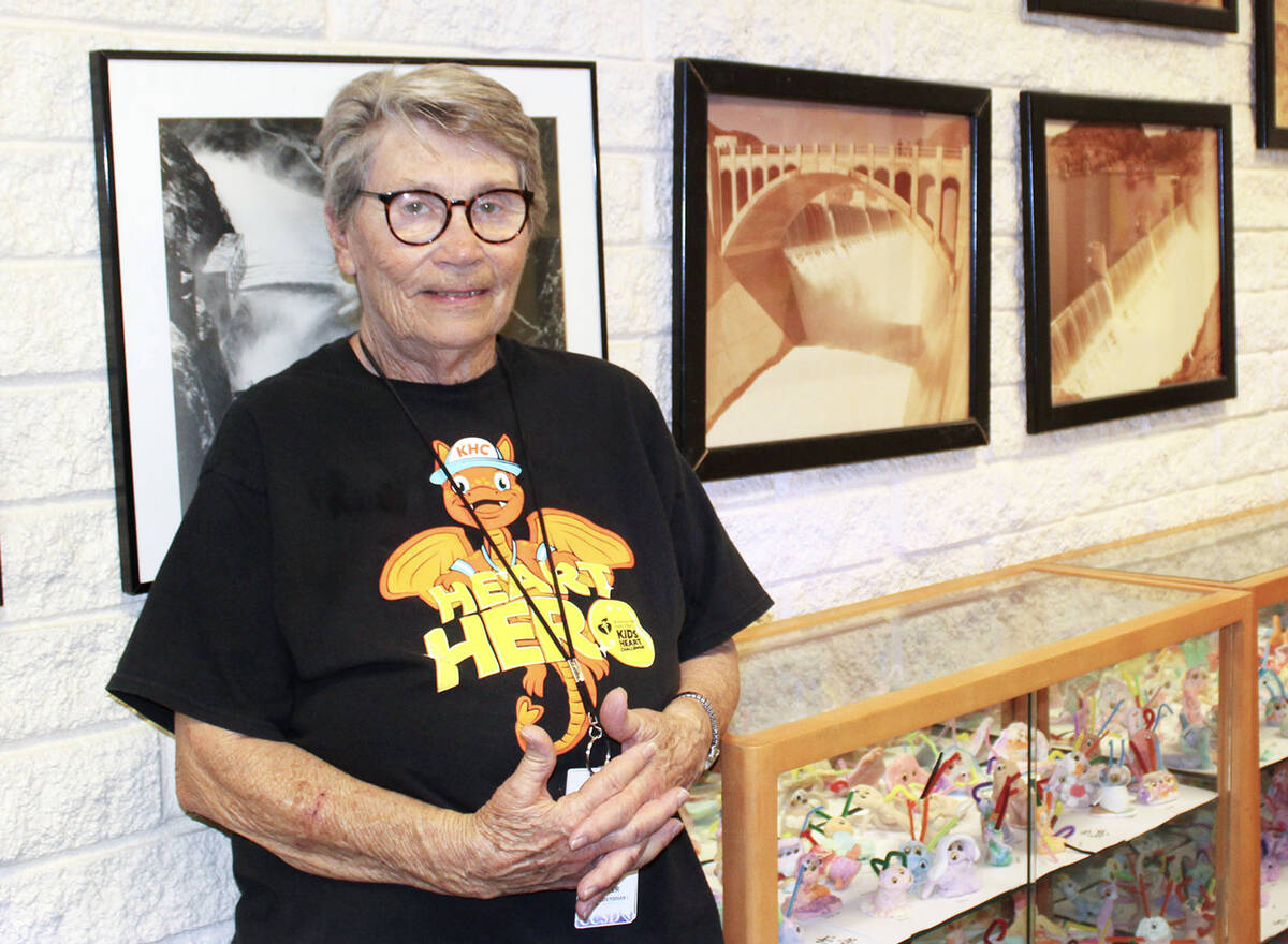 Linda Easter, seen here at one of her favorite spots at the school, has been a custodian with A ...