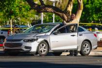 Metro police investigate a car after a female high school student was struck in front of Arbor ...