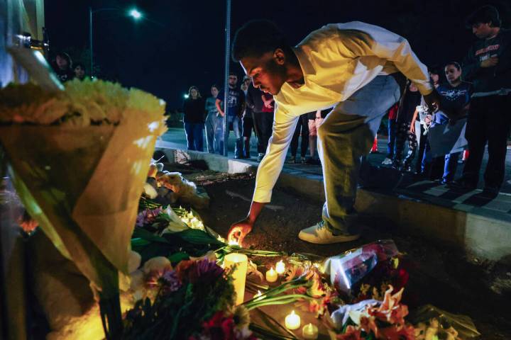 Arbor View students gather outside of their school for a vigil in honor of McKenzie Scott, a hi ...