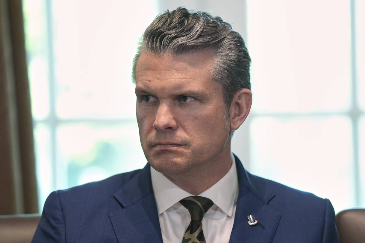Secretary of Defense Pete Hegseth listens during a cabinet meeting at the White House, Wednesda ...