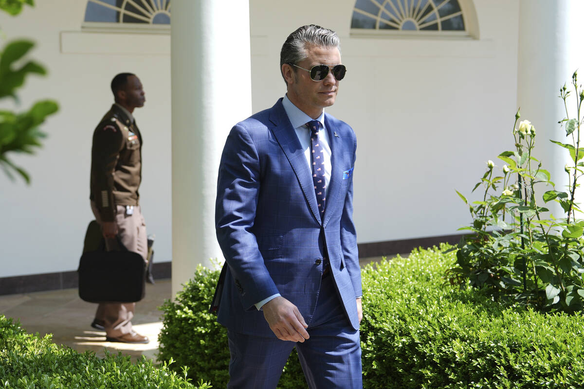 Defense Secretary Pete Hegseth arrives before President Donald Trump speaks during a National D ...