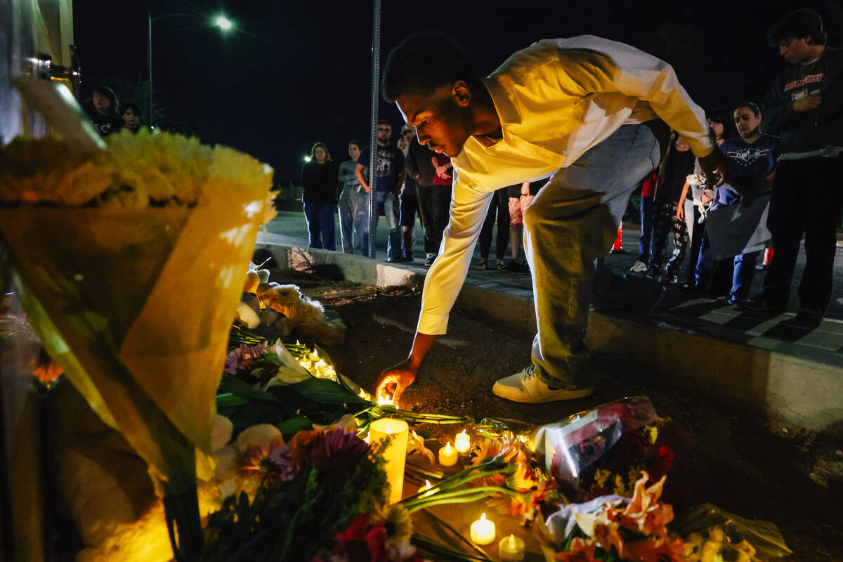 Arbor View students gather outside of their school for a vigil in honor of McKenzie Scott, a hi ...