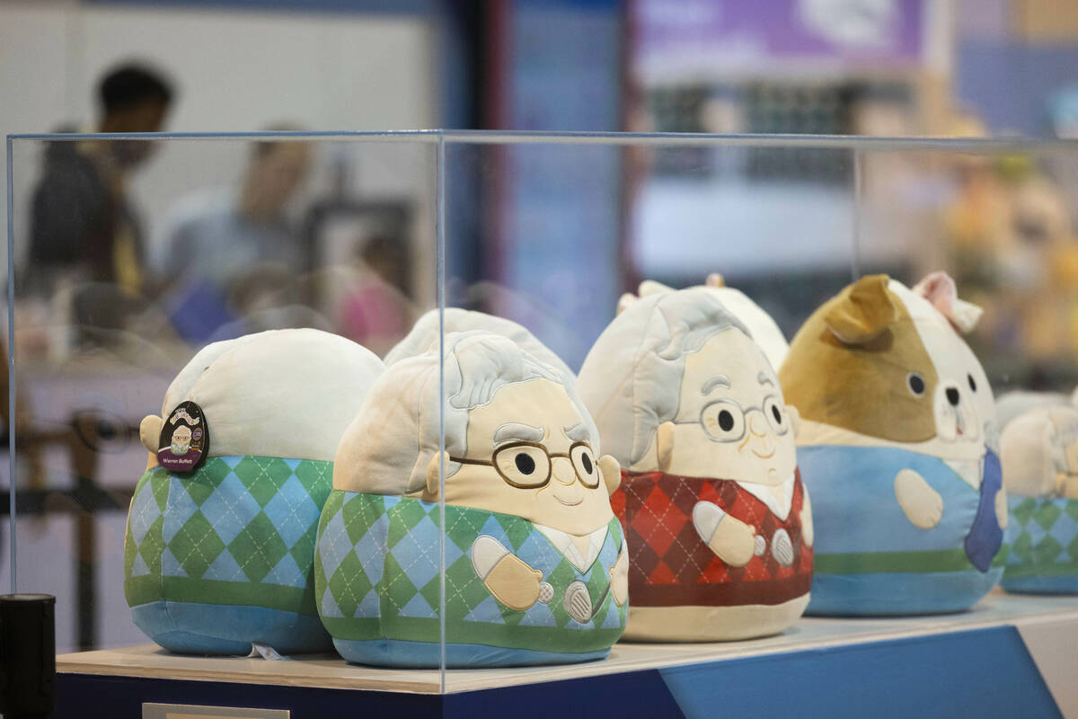 Squishmallows in the likeness of Warren Buffett, left, and Charlie Munger sit on display and fo ...