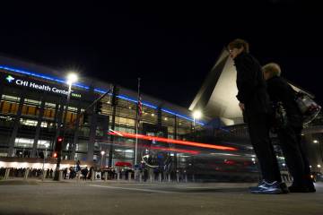 Shareholders arrive outside CHI Health Center Omaha for the Berkshire Hathaway annual meeting S ...
