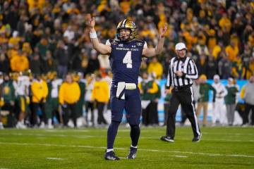 Montana State quarterback Tommy Mellott gestures after throwing a touchdown against North Dakot ...