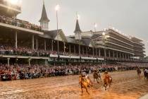 Sovereignty, left, ridden by Junior Alvarado, crosses the finish line to win the 151st running ...