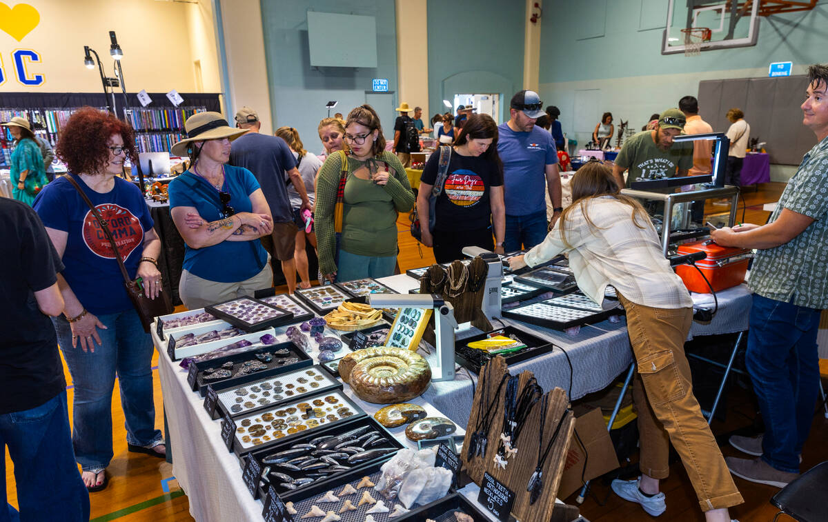 People wander and purchase items in the Southern Nevada Gem and Mineral Society Show during the ...