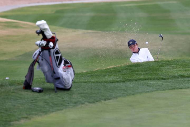 Scott Boschee of Bishop Gorman hits out of the sand on the second hole during the NIAA 5A Mount ...