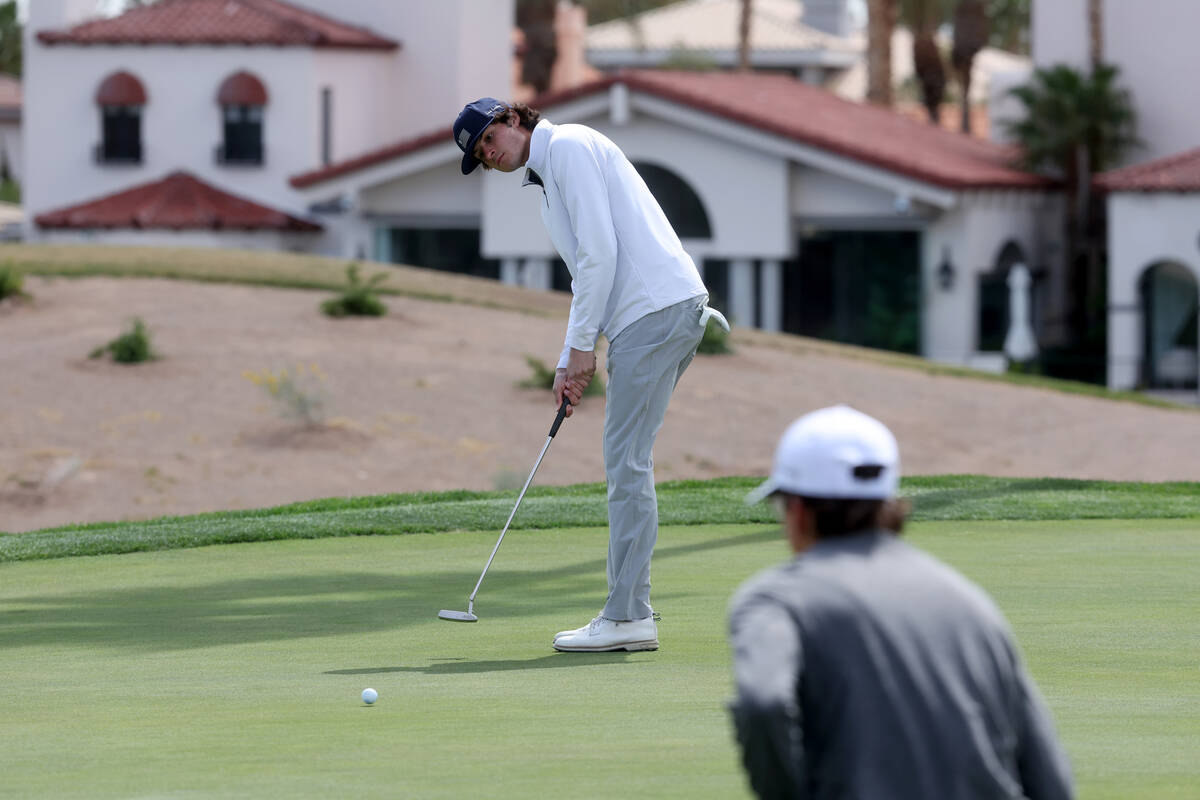 Wade Arcella of Bishop Gorman putts on the second hole during the NIAA 5A Mountain League golf ...