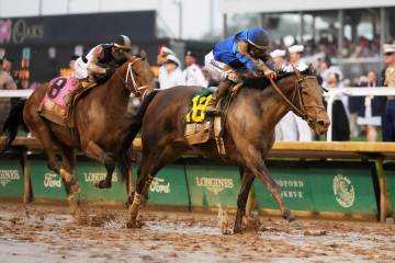 Sovereignty, right, ridden by Junior Alvarado, crosses the finish line to win the 151st running ...
