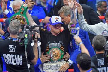 Canelo Alvarez, center, celebrates after wining against William Scull during super middleweight ...