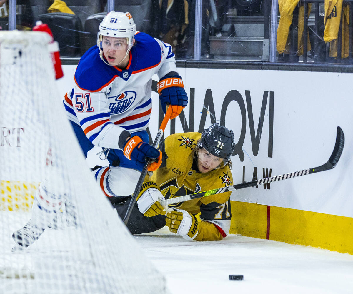 Golden Knights center William Karlsson (71) looks to the puck after a collision with Edmonton O ...